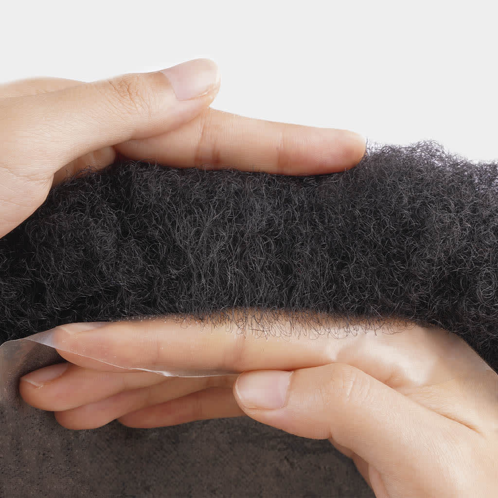 Top view of Afro Skin hair system showing thin skin base and curl pattern